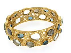 Gold bracelet with gemstones